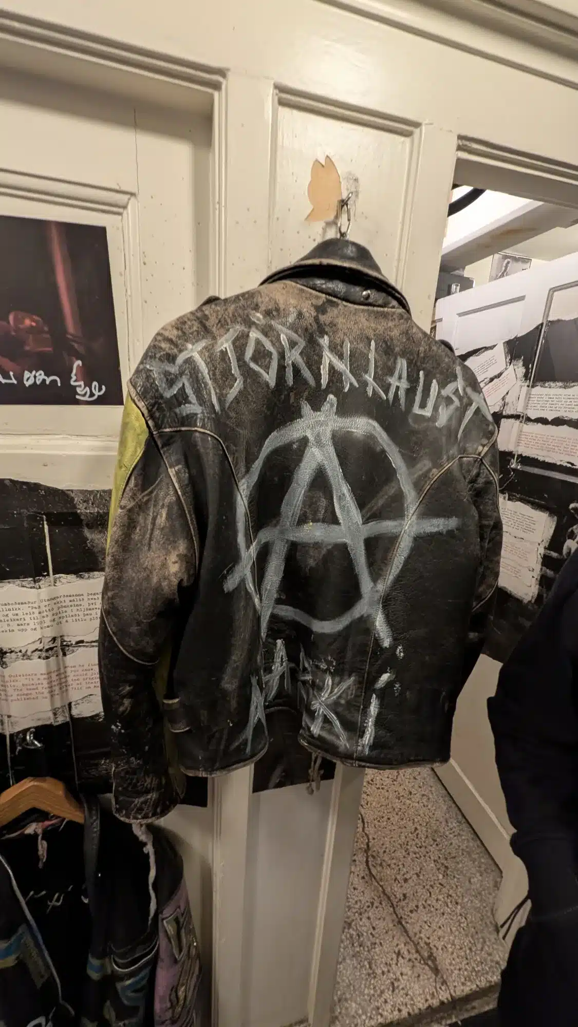 Black leather jacket painted with an anarchy symbol in a Reykjavík shop
